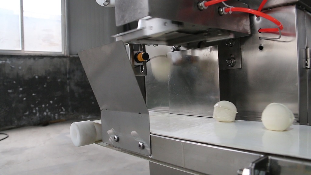 Dough divider evenly dividing dough into portions